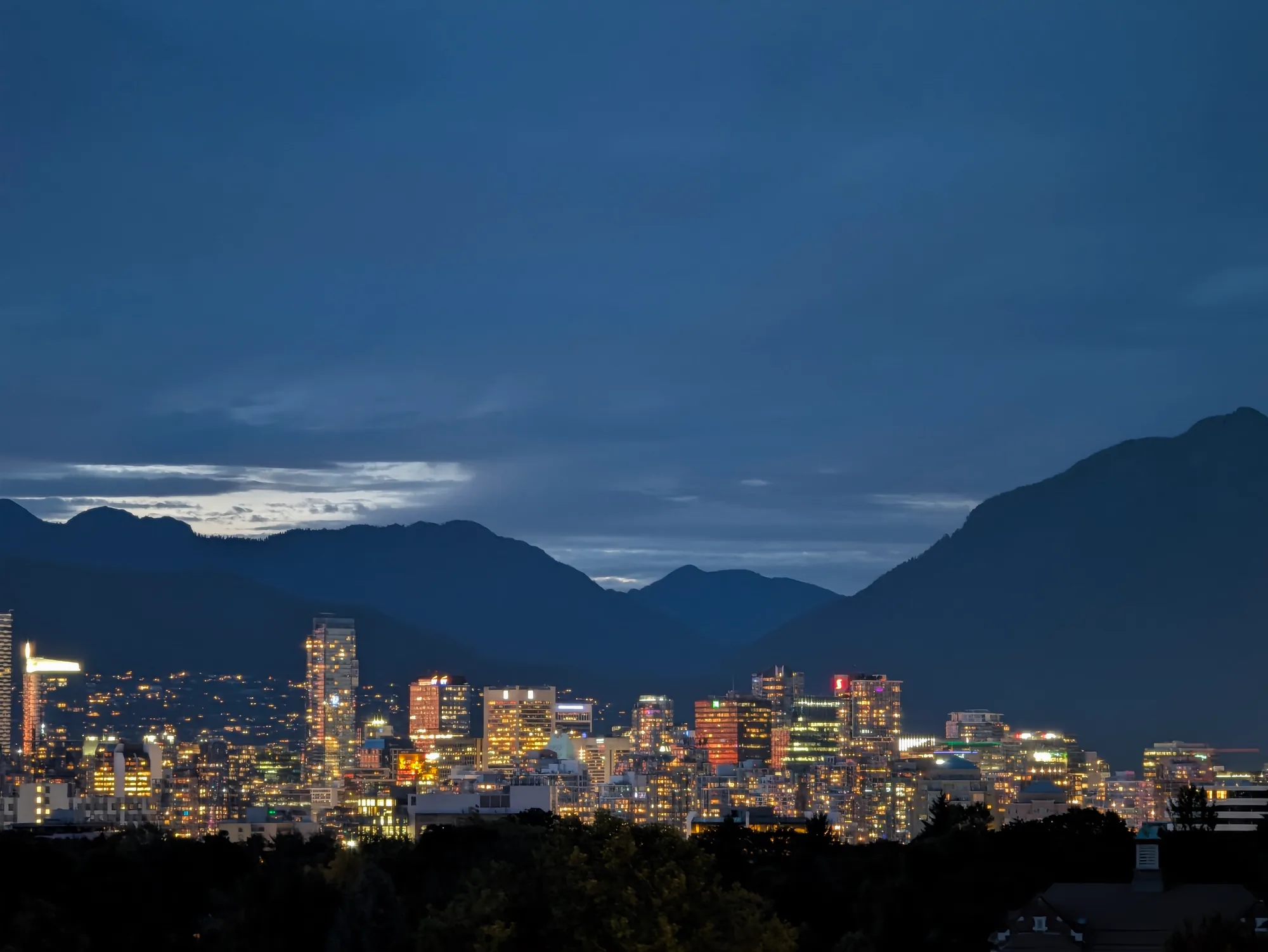 Vancouver skyline and mountains at dusk